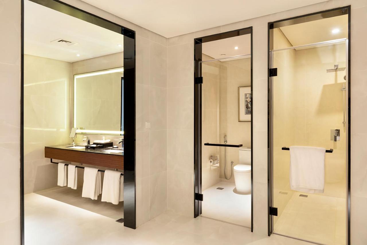 Asiana Grand Hotel Dubai Exterior photo A bathroom with a shower room