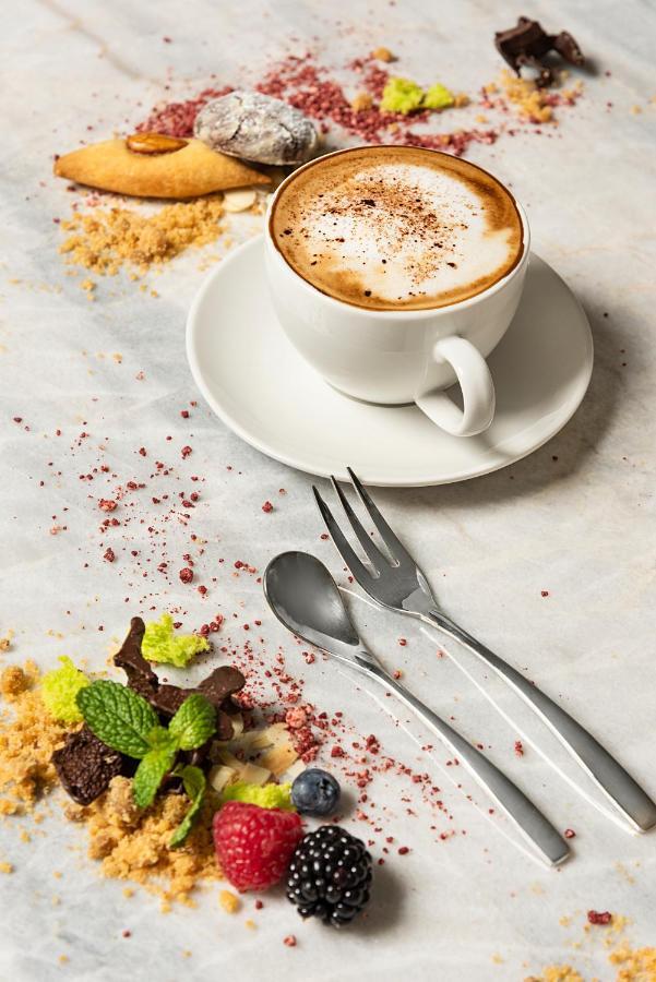 Asiana Grand Hotel Dubai Exterior photo A coffee cup with a saucer